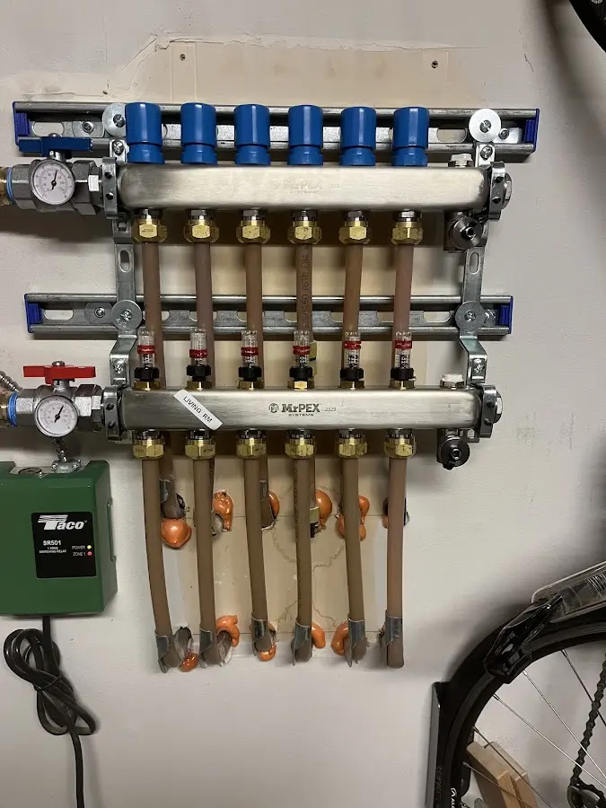 Plumber performing Water Heater Repair at a residential property in Lowell